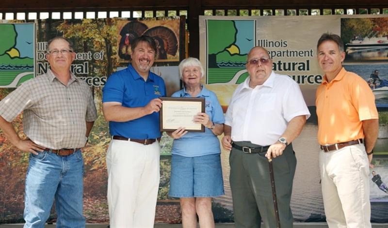 Joannett Fleming receives certificate from IDNR Director